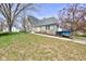 View of the home exterior featuring well-manicured lawn and inviting entrance at 6170 Shelbyville Rd, Indianapolis, IN 46237