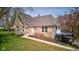 Charming stone home with well-maintained lawn and garden beds at 6170 Shelbyville Rd, Indianapolis, IN 46237