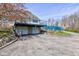 The exterior features a three car garage, fenced-in yard, and stone wall at 6170 Shelbyville Rd, Indianapolis, IN 46237