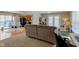 Cozy living room area featuring a comfortable sofa and view into the kitchen and dining area at 6170 Shelbyville Rd, Indianapolis, IN 46237