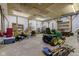 Spacious shed interior with wood framed walls, concrete floor, and ample storage at 6170 Shelbyville Rd, Indianapolis, IN 46237