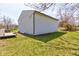 Angle view of the white metal shed located in the backyard of this property at 6170 Shelbyville Rd, Indianapolis, IN 46237