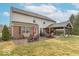 Spacious backyard featuring a covered patio with outdoor seating, perfect for entertaining and relaxation at 6272 Turnbridge Dr, Avon, IN 46123