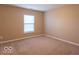 Neutral bedroom featuring carpeted floors and a window at 6272 Turnbridge Dr, Avon, IN 46123