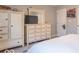 This bedroom features a dresser and wardrobe with off-white finish and carpet flooring at 6272 Turnbridge Dr, Avon, IN 46123