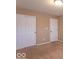 Bedroom showcasing neutral walls, carpet, and closet with sliding doors at 6272 Turnbridge Dr, Avon, IN 46123