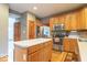 Bright kitchen with wood cabinets, stainless steel appliances, and a functional island at 6272 Turnbridge Dr, Avon, IN 46123