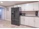 Basement kitchenette with white cabinets and black appliances at 6272 Turnbridge Dr, Avon, IN 46123