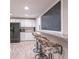 Basement kitchenette with white cabinets and granite countertops at 6272 Turnbridge Dr, Avon, IN 46123