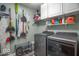 Organized laundry room with white cabinets, shelving, modern washer and dryer, and storage for cleaning supplies at 6272 Turnbridge Dr, Avon, IN 46123