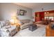 Cozy living room with comfortable seating and neutral decor adjoining a dining area at 6272 Turnbridge Dr, Avon, IN 46123