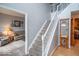 Inviting foyer showcases a carpeted staircase leading to the upper level of the home at 6272 Turnbridge Dr, Avon, IN 46123