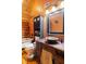 Rustic bathroom with clawfoot tub, vessel sink, and charming log walls at 6351 Dixon Rd, Columbus, IN 47201