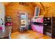 Cozy bedroom featuring wood walls, a bunk bed, and natural light from the window at 6351 Dixon Rd, Columbus, IN 47201