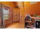 Bright bedroom featuring wood floors, wood paneling, and built-in storage at 6351 Dixon Rd, Columbus, IN 47201
