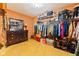 Walk-in closet with organized storage and a dark wood dresser at 6351 Dixon Rd, Columbus, IN 47201