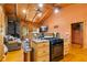Kitchen featuring stone countertops, wood cabinets, and stainless steel appliances at 6351 Dixon Rd, Columbus, IN 47201