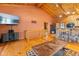 Bright living room with wood floors, beamed ceilings, and a stone breakfast bar at 6351 Dixon Rd, Columbus, IN 47201