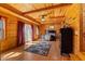 Bright Primary bedroom with wood floors, a ceiling fan, and access to the outdoors at 6351 Dixon Rd, Columbus, IN 47201