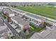 An aerial view of townhouses in a well-maintained community with green spaces and manicured lawns at 6379 Fairfield St, Whitestown, IN 46075