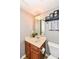 Powder room with a vanity, framed mirror and modern fixtures at 6379 Fairfield St, Whitestown, IN 46075