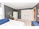 Bedroom featuring gray walls, a bed, and a white cabinet with double doors at 6379 Fairfield St, Whitestown, IN 46075
