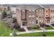 Lovely brick townhome featuring professional landscaping and a welcoming entryway at 6379 Fairfield St, Whitestown, IN 46075