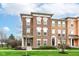 Charming brick townhome with manicured lawn and bright, sunny curb appeal at 6379 Fairfield St, Whitestown, IN 46075