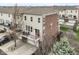 Charming three-story townhouse with a balcony, a garage, and a combination of siding and brick exterior at 6379 Fairfield St, Whitestown, IN 46075