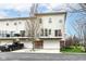 Townhouse exterior featuring individual patios and garage doors with a black pickup truck parked nearby at 6379 Fairfield St, Whitestown, IN 46075