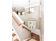 Bright foyer with front door, a chandelier, and an open staircase at 6379 Fairfield St, Whitestown, IN 46075