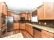 Modern kitchen with stainless steel appliances, granite countertops, and ample cabinet space at 6379 Fairfield St, Whitestown, IN 46075
