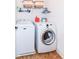 Laundry room featuring a front loading washer and a top loading washing machine at 6379 Fairfield St, Whitestown, IN 46075