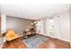 Inviting living room area with hardwood floors, recessed lighting, and large windows at 6379 Fairfield St, Whitestown, IN 46075