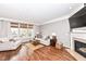 Cozy living room with a fireplace, neutral-toned furniture, and ample natural light at 6379 Fairfield St, Whitestown, IN 46075