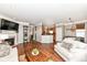Open-concept living space with fireplace, TV, and access to the kitchen and breakfast nook at 6379 Fairfield St, Whitestown, IN 46075