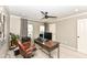Home office featuring a wooden desk, leather office chair, and natural light at 6379 Fairfield St, Whitestown, IN 46075