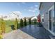 Beautiful backyard featuring a patio area surrounded by manicured landscaping and a green lawn at 6476 W Mulberry Way, Greenfield, IN 46140