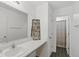 Clean bathroom features a large vanity mirror with tiled floors and shower with full tub at 6476 W Mulberry Way, Greenfield, IN 46140