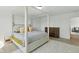 Comfortable primary bedroom with a four poster bed, offering a relaxing retreat at 6476 W Mulberry Way, Greenfield, IN 46140