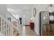 Inviting entryway with wood flooring, a stylish staircase, and modern decor at 6476 W Mulberry Way, Greenfield, IN 46140