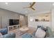 Cozy living room with modern fixtures, TV, and stylish furniture adjacent to kitchen at 6476 W Mulberry Way, Greenfield, IN 46140