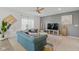 Bright living room features contemporary furniture, a ceiling fan, and elegant decor at 6476 W Mulberry Way, Greenfield, IN 46140