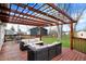 Back deck with outdoor seating and pergola, ideal for gatherings and relaxation at 676 Nelson Dr, Mooresville, IN 46158