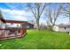 Lush backyard with a deck and pergola, ideal for outdoor relaxation at 676 Nelson Dr, Mooresville, IN 46158
