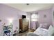 Cozy bedroom with hardwood floors, natural light, and closet space at 676 Nelson Dr, Mooresville, IN 46158