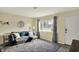 Cozy living room featuring a blue sofa, soft rug, and ample natural light at 676 Nelson Dr, Mooresville, IN 46158