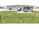 Well-manicured backyard featuring a concrete patio, shaded gazebo, and a lush lawn, ideal for outdoor activities at 694 N Sobota Way, Trafalgar, IN 46181