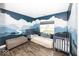 Bedroom bedroom with a scenic mural, two cribs, and a daybed at 694 N Sobota Way, Trafalgar, IN 46181