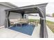 Relaxing gazebo with cozy sectional, rocking chair, and blue outdoor rug for relaxing afternoons at 694 N Sobota Way, Trafalgar, IN 46181
